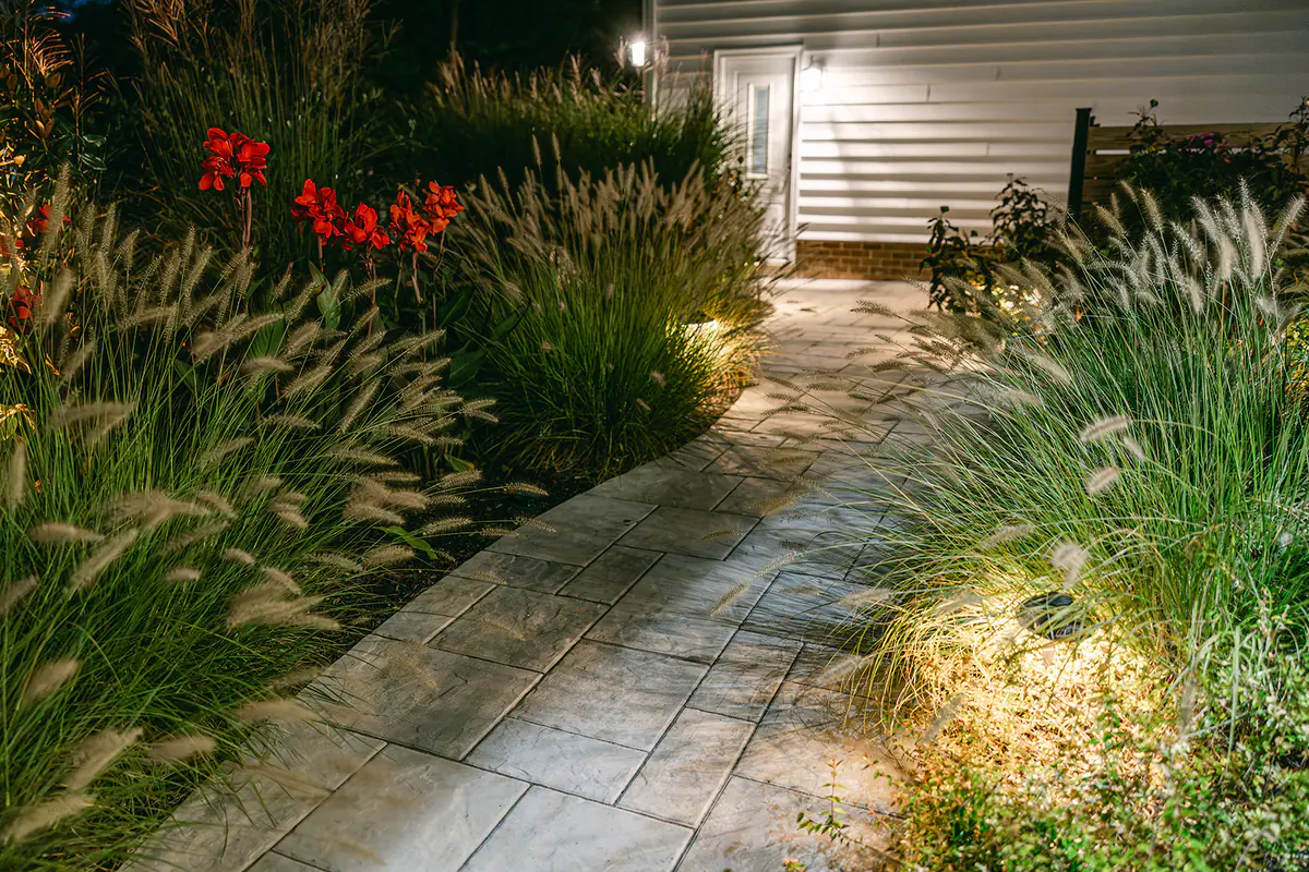 walkway at night with lights