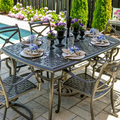 Backyard pool area with paver patio and furnished outdoor table