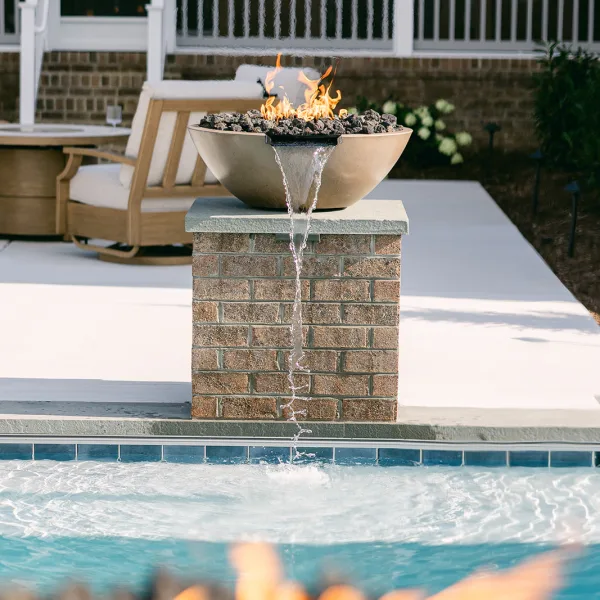 Elegant poolside fire bowls with automated controls