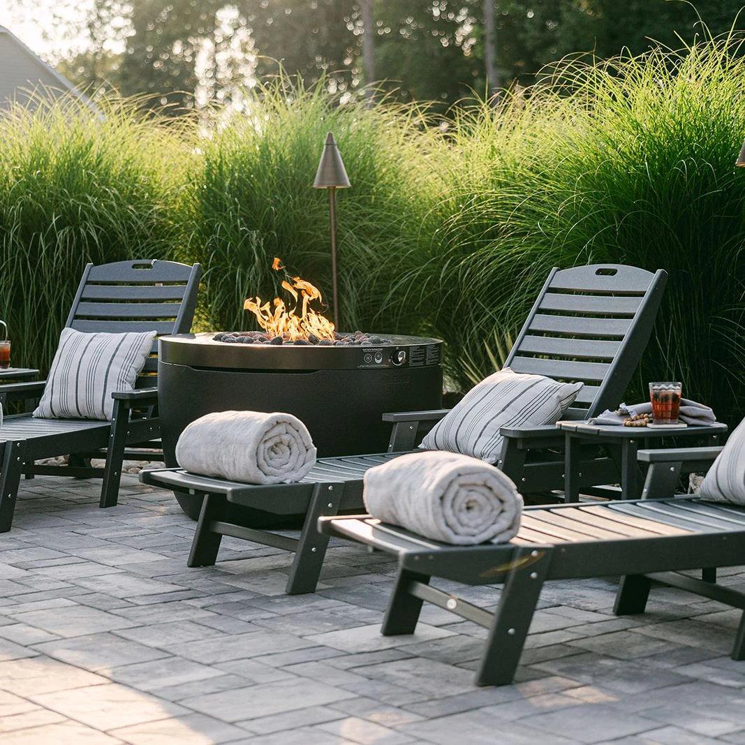 	ProVia Terra Cut stone fire bowl on elevated patio tier