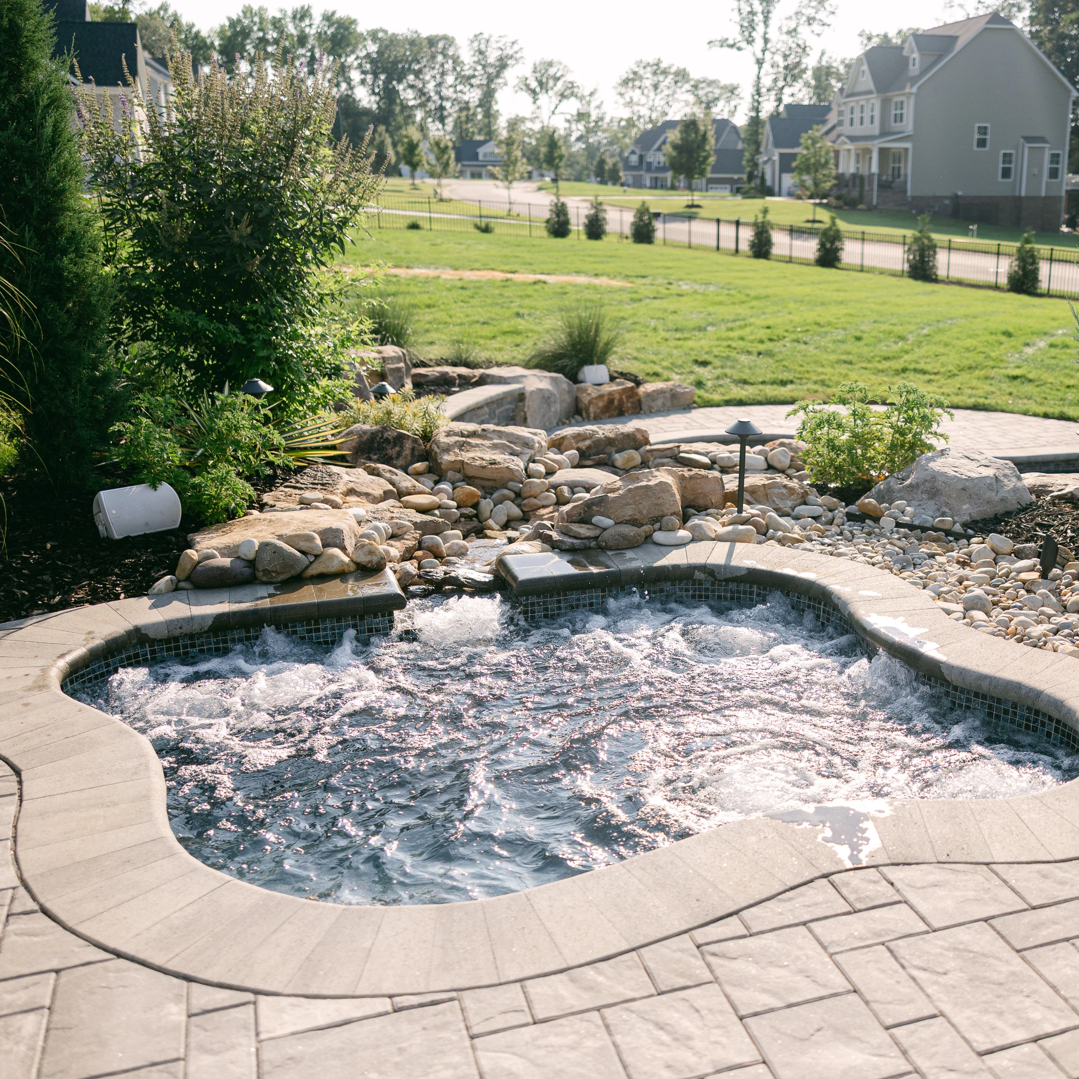 Regal spa and pool combo with curved design