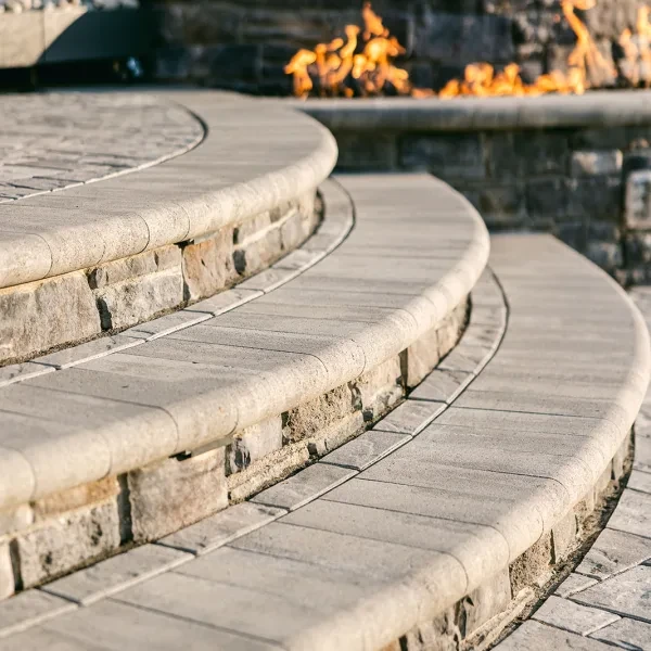 Three-level hardscape with stone caps and ornamental planting