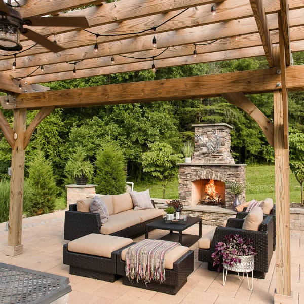 Paver patio with outdoor fireplace and pergola
