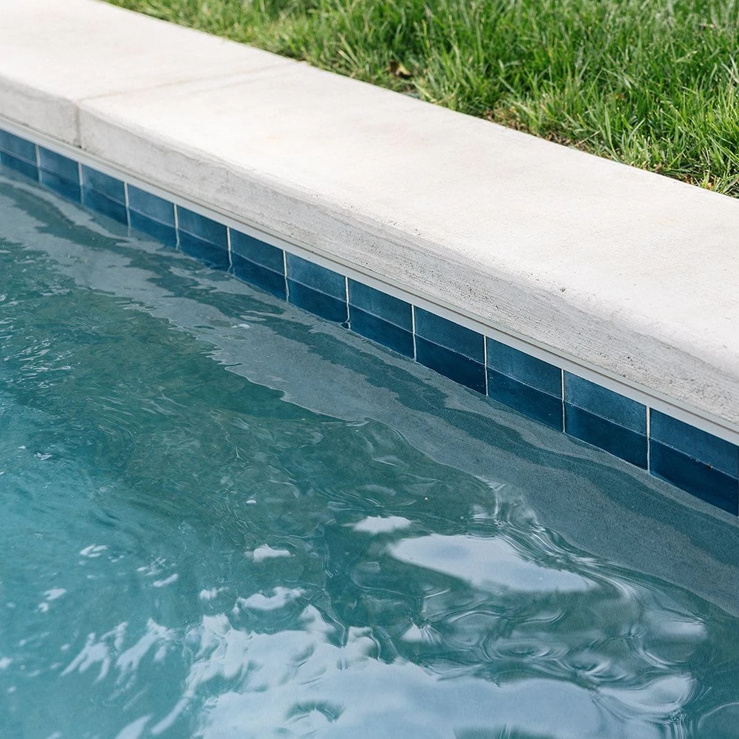 Durable concrete decking surrounding elegant gunite pool
