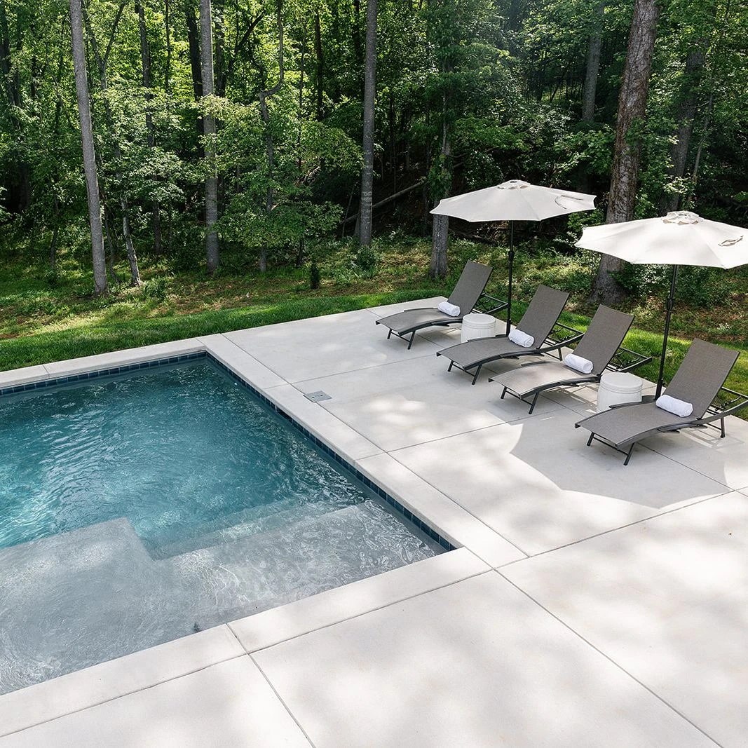 Luxury inground pool with clean lines and integrated safety cover