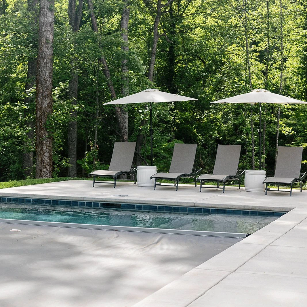Modern rectangular pool with integrated automatic cover and swim lane