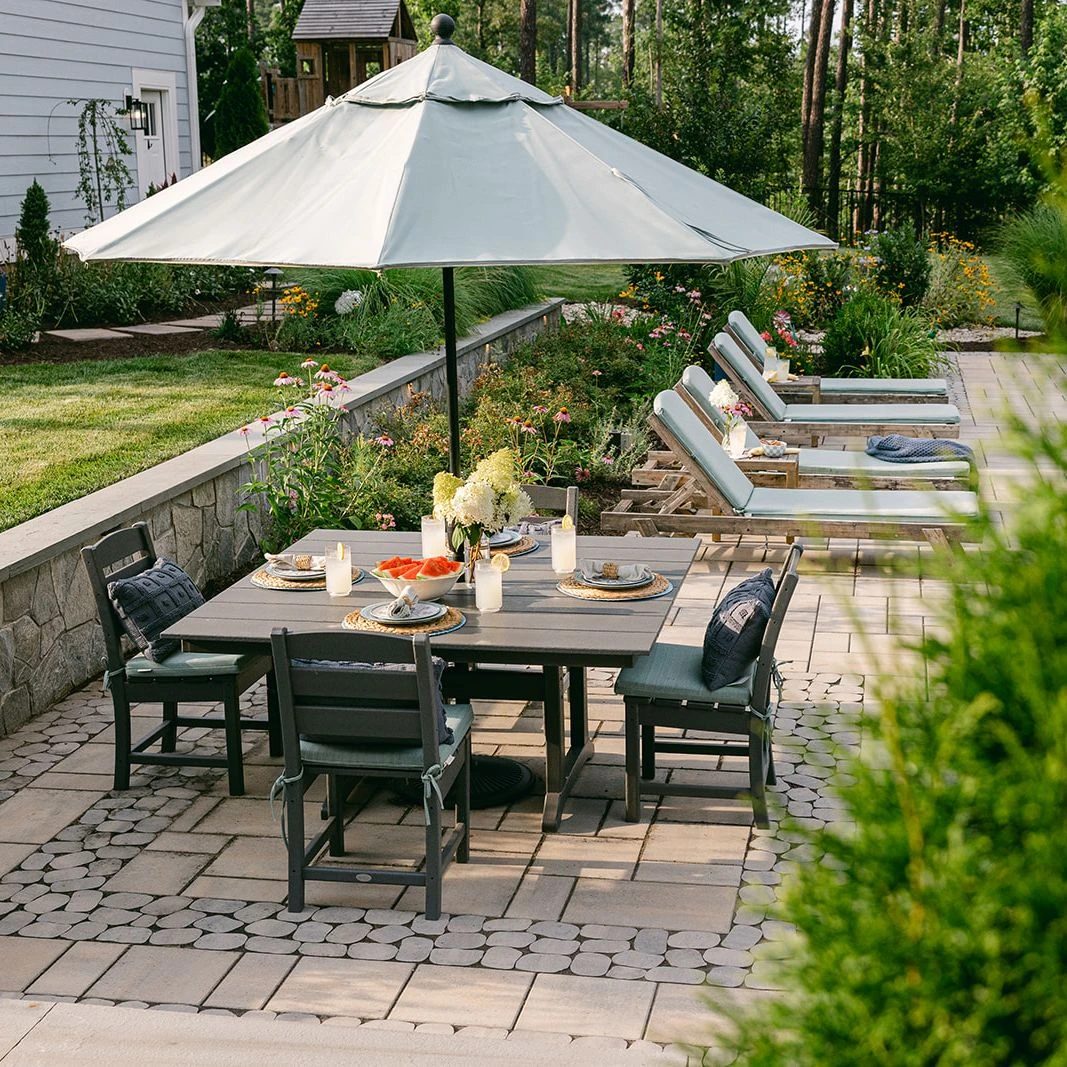 Outdoor lounge seating under modern umbrella