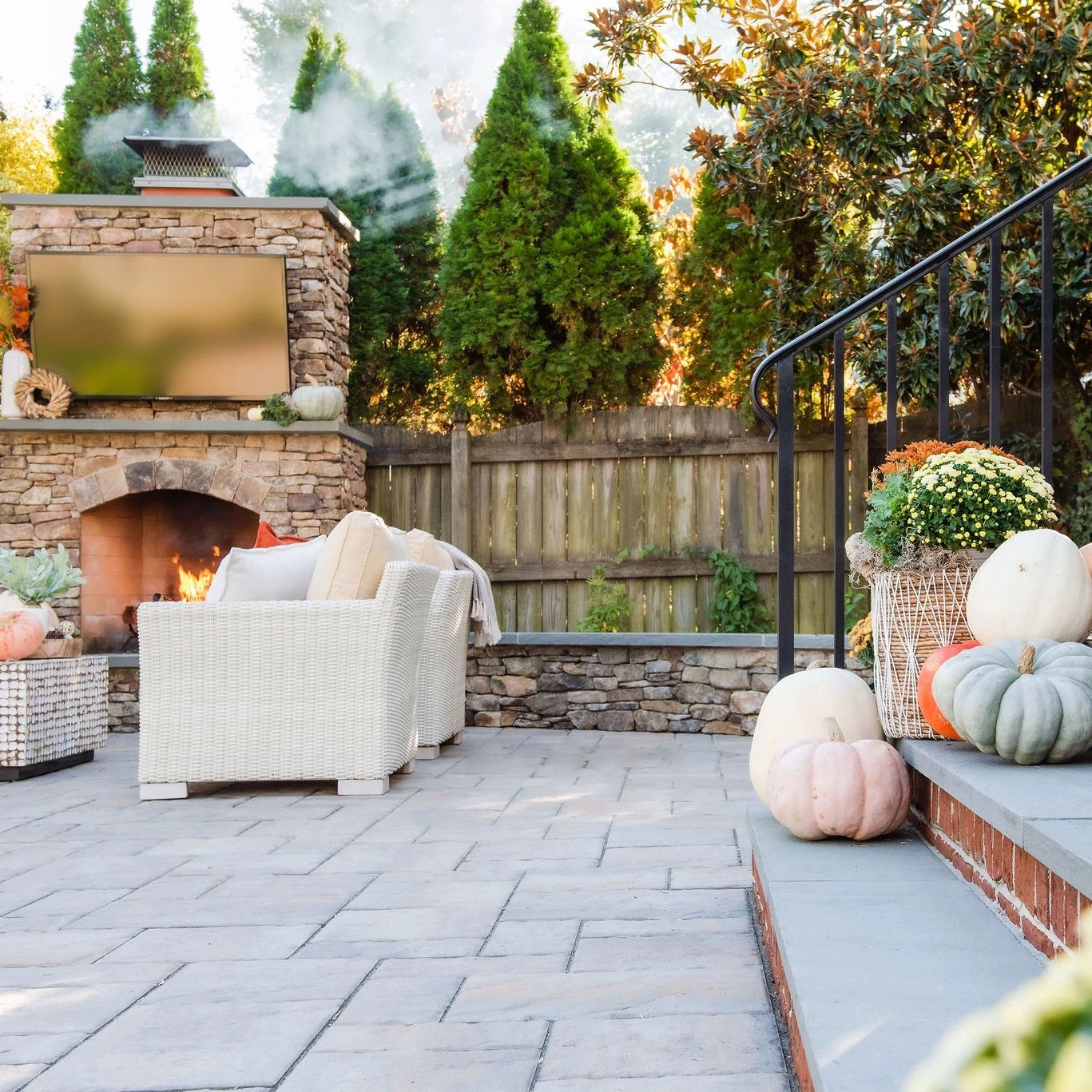 Backyard seating area with paver patio and fire feature