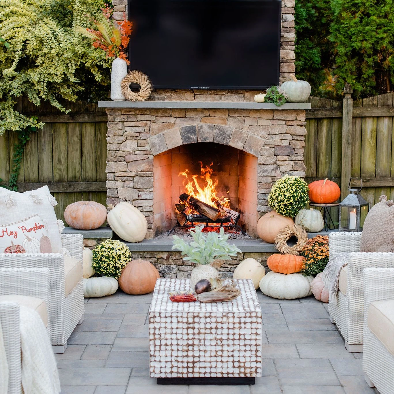 Outdoor TV mounted on custom fireplace