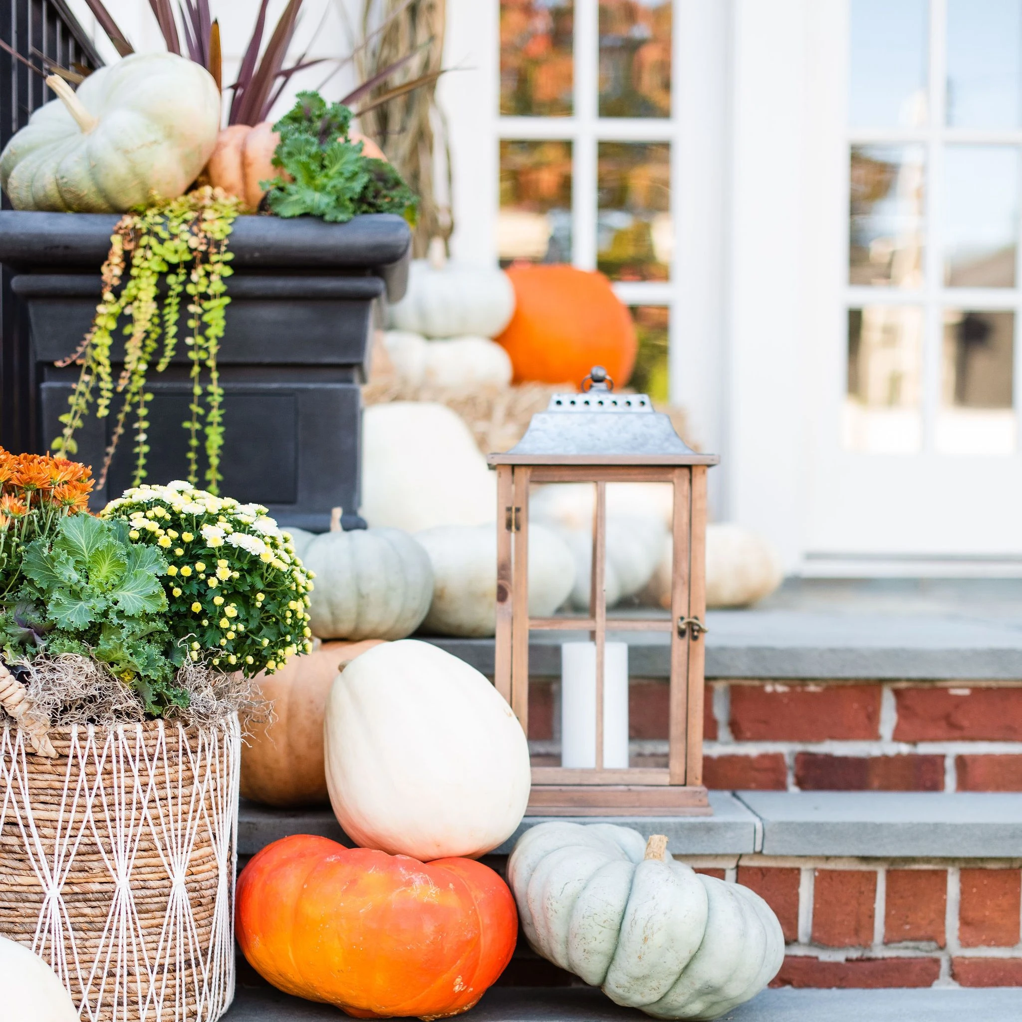 pumpkins and lanterns on stairs