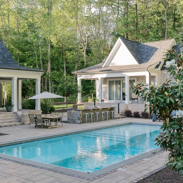 	20x40 gunite pool with tanning ledge, wall fountain, and swim lane