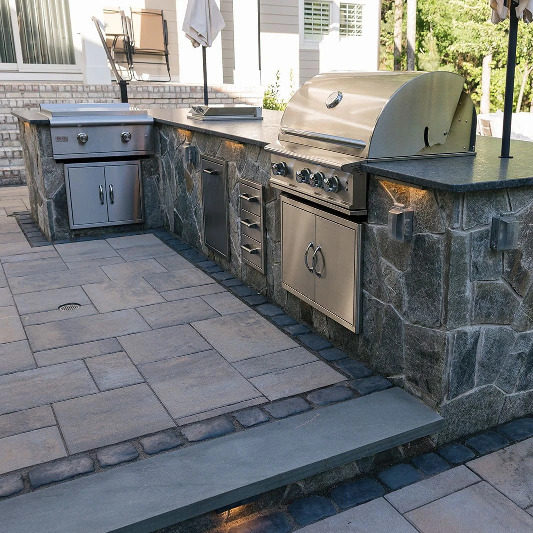 Fully equipped kitchen with griddle, ice chest, and storage drawers