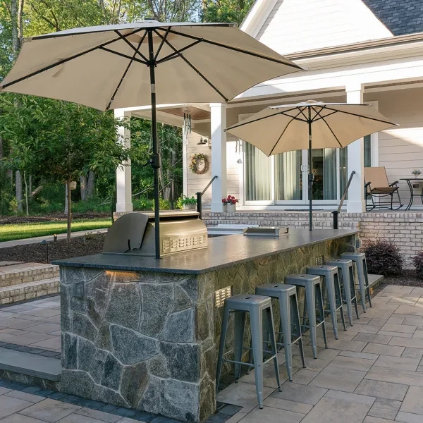 Outdoor kitchen with Silver Pearl granite countertop and built-in grill