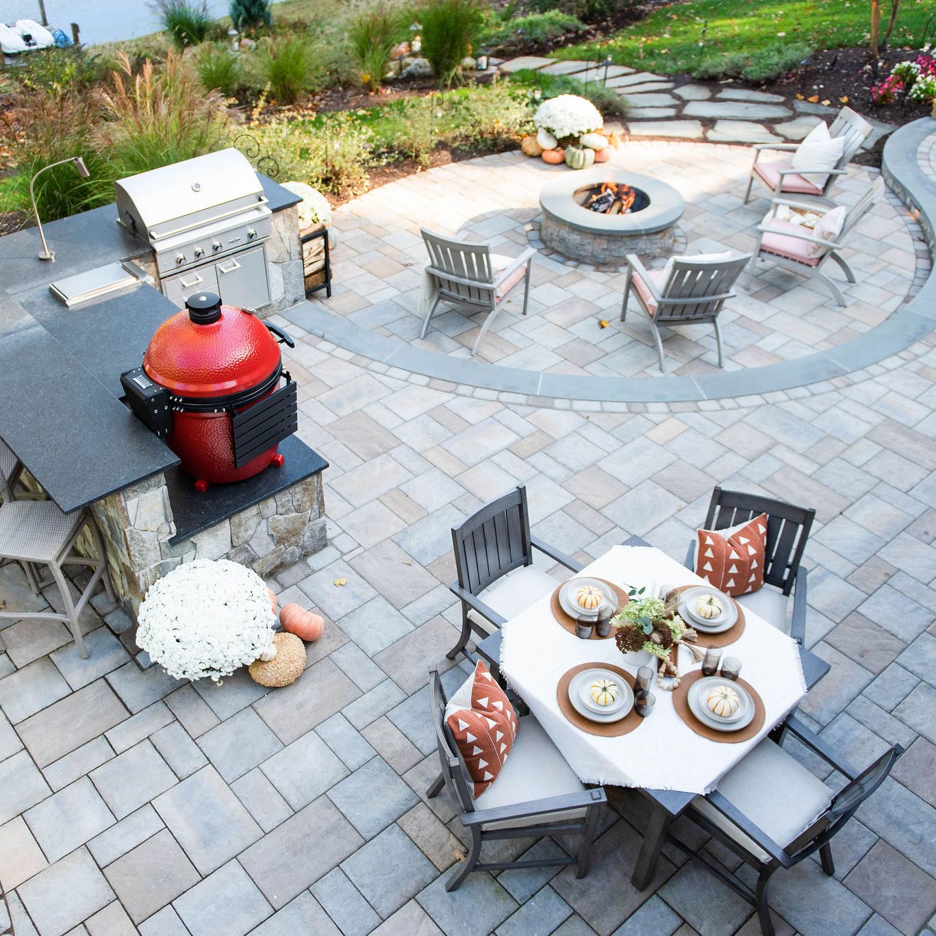Lakefront paver patio with built-in fire pit