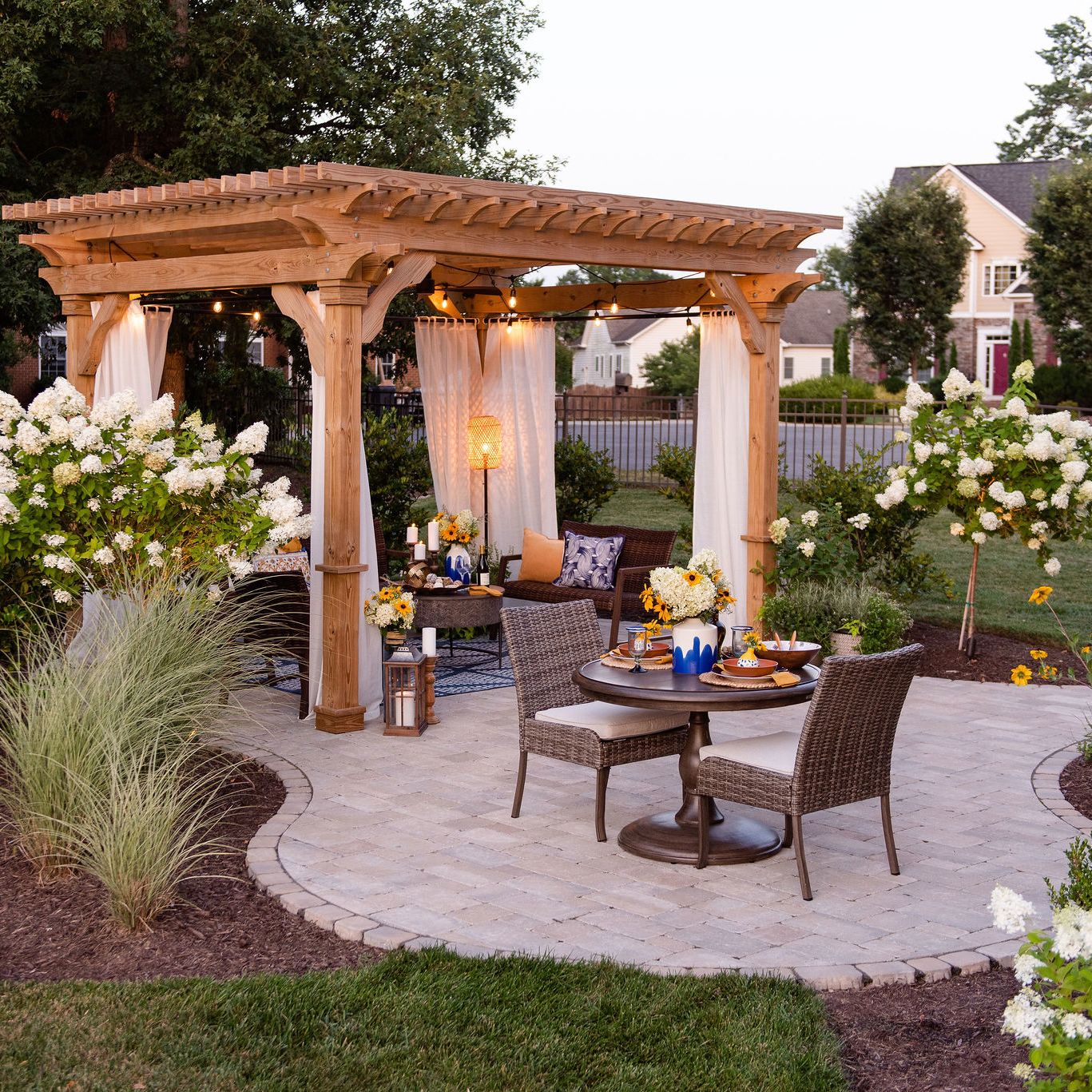 Paver patio with pergola and landscaping