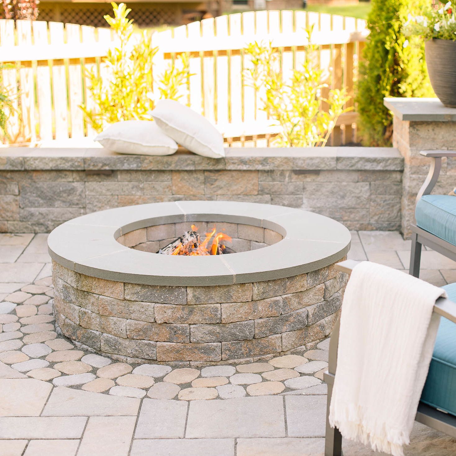 classic permanent fire pit installed in patio