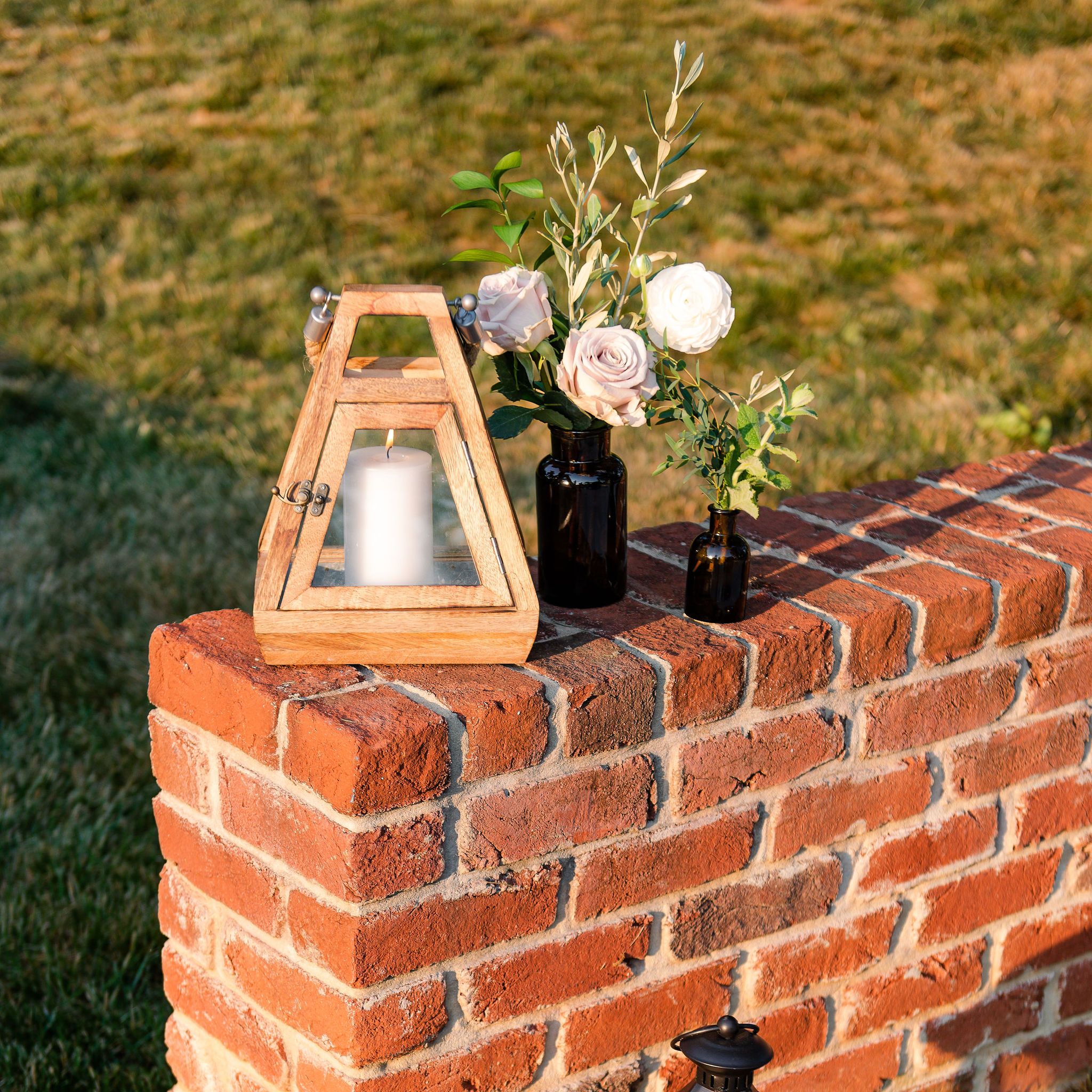 Handmade brick sitting wall with decorative lanterns