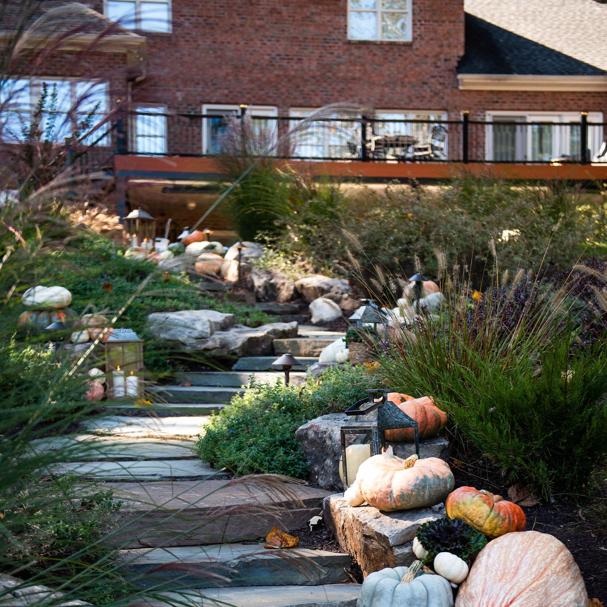 Bluestone and fieldstone stairway connecting patio to lake