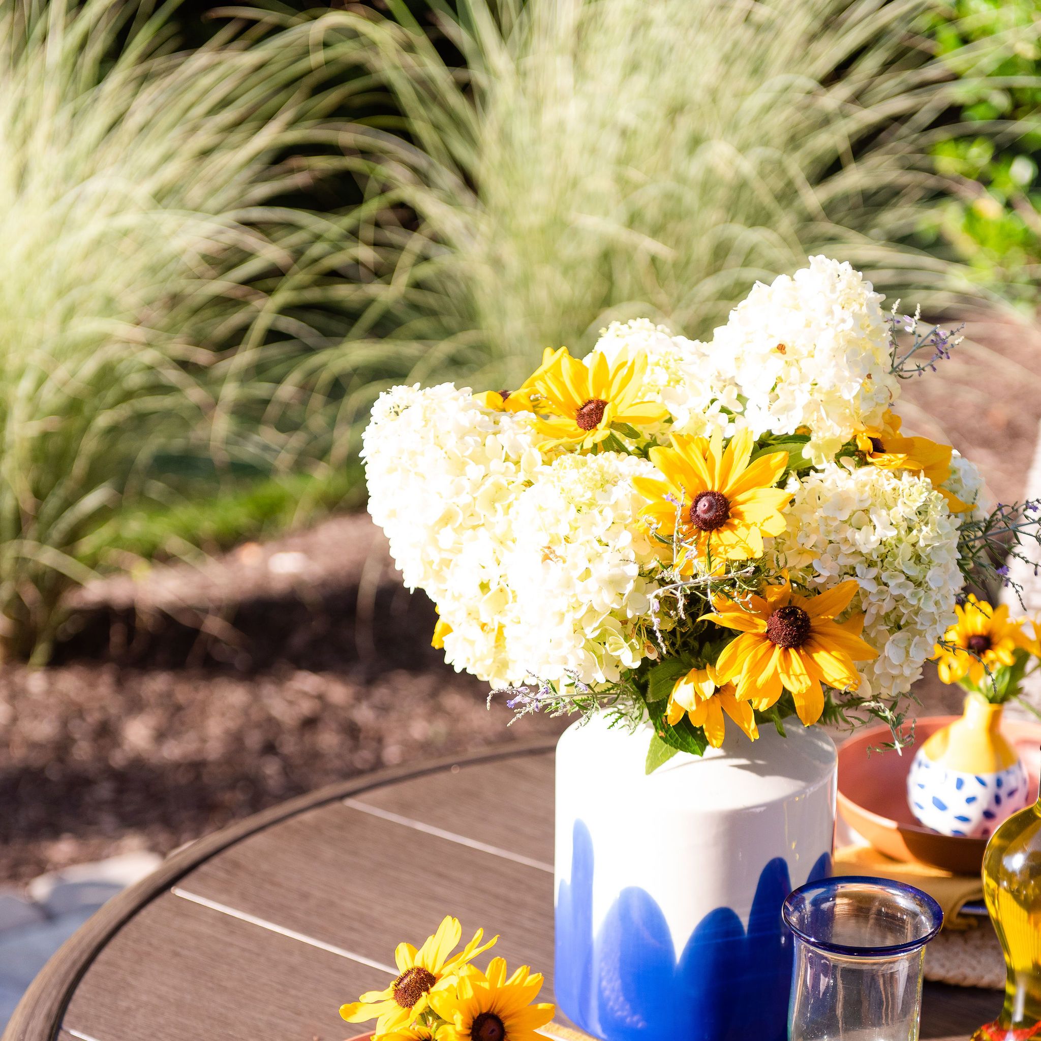 Dining table with cut flowers from the landscape