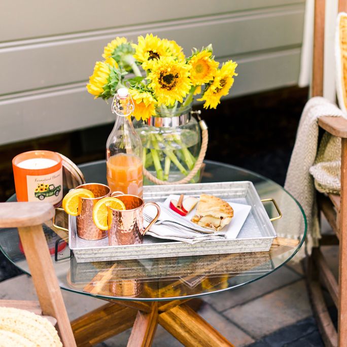 outdoor table set with sunflowers and summer mules