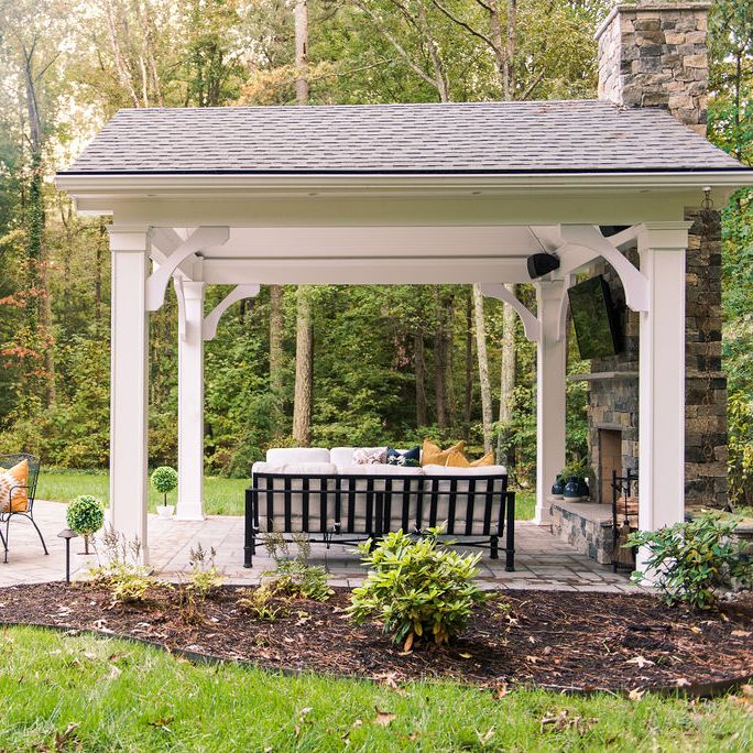 Paver patio with pavilion and outdoor fireplace